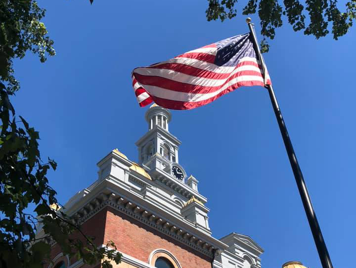 American flag in front of courthouse